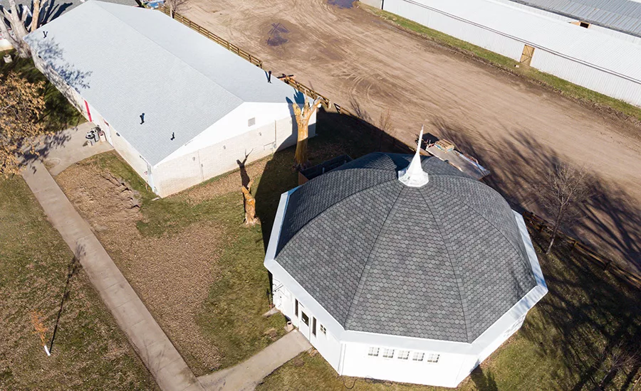 The contractor chose to create a rounded or “fish scale” look, determining that this would help bring an older, aesthetically pleasing architecture to this older building.