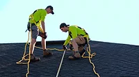 construction workers on a roof