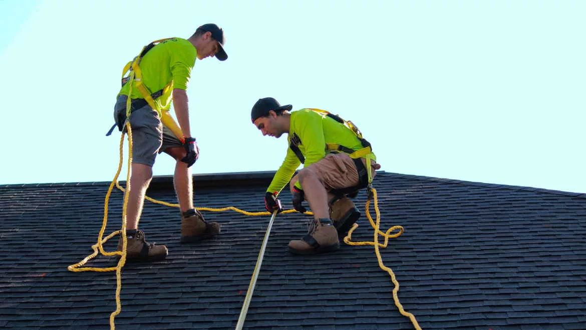 construction workers on a roof