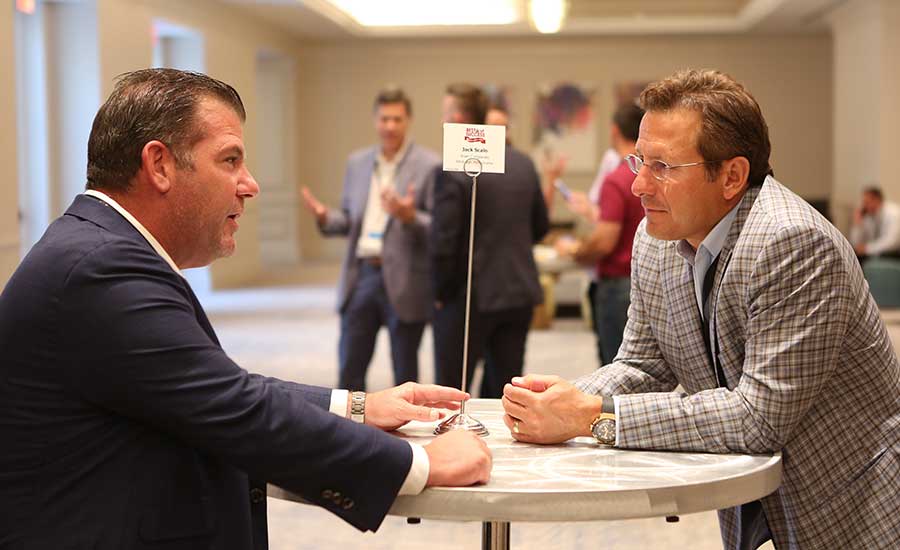 Curtis Sutton speaks with Jack Scalo, president/CEO of Burns & Scalo Roofing, at Best of Success.