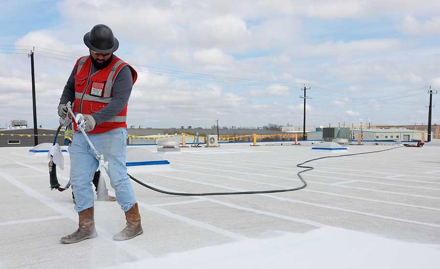 An installer uses GacoFlex on a commercial roof