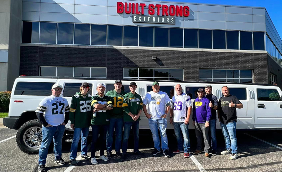 Built Strong employees show off a friendly inter-office football rivalry between the Green Bay Packers and Mineesota Vikings.