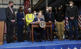 President Biden signing the new regulatory change into law in Feb. 2022.