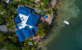A striking blue metal roof by Pac-Clad (pictured) has given a villa on St. John in the the U.S.V.I. a new lease on life.