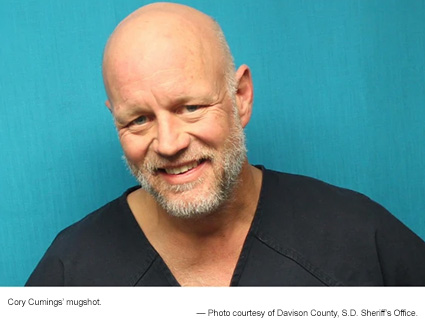 Cory Cumings' mug shot (pictured).