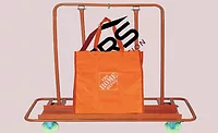 Home-Depot-SRS-Deal-Closes A Home Depot shopping bag containing the SRS Distribution logo (pictured).