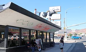 The cow that has stood atop the Top Spot eatery in Cedar City, Utah, came down for the last time in early August. Photo by Jeff Richards, St. George News