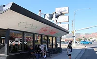 Top Cow.jpg The cow that has stood atop the Top Spot eatery in Cedar City, Utah, came down for the last time in early August. Photo by Jeff Richards, St. George News