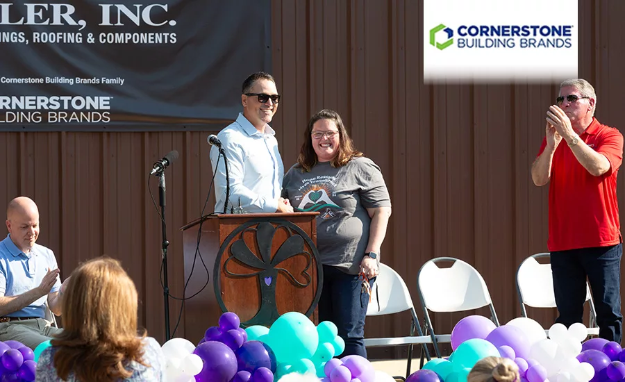 Bethany Black, executive director of the Women’s Crisis Services of LeFlore County, Okla., gets the keys to the organization’s new building (pictured).