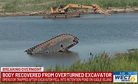 A screengrab showing the excavator overturned and the cab fully submerged following the accidental death of a 27-year-old construction worker in North Carolina. 