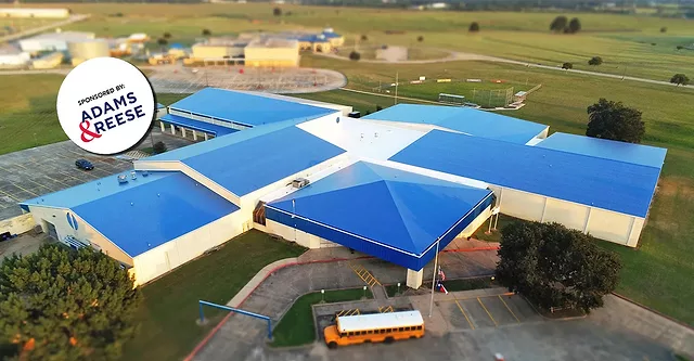A blue roof on a school building