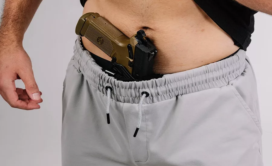 A man accidentally shot himself with a stolen gun that he tried to ditch on a roof.