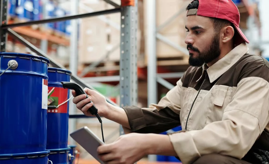 a warehouse worker scans a bucket of a construction project