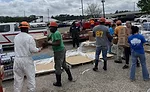 GP-Employees-unloading-products-in-a-parking-lot