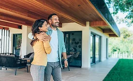 A couple standing in their new home