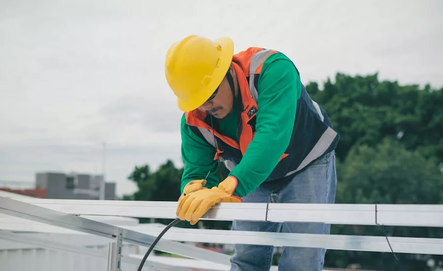 latino-worker-working-on-metal-roofing