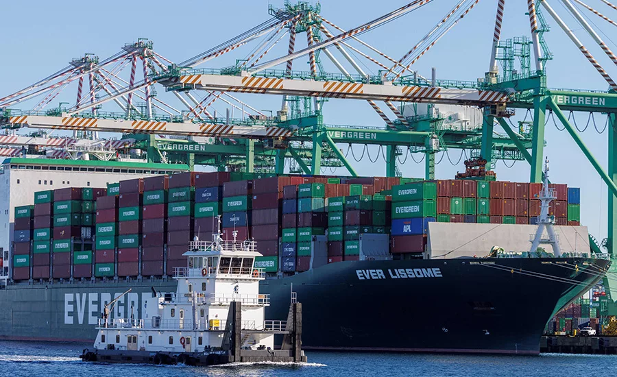 Containers sit idle at the Port of Los Angeles as import volumes plunge, signaling supply-chain strain and rising costs for U.S. construction and roofing contractors.