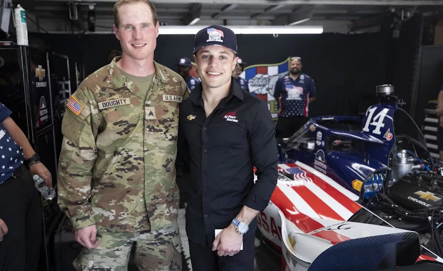 Santino Ferrucci standing with military veteran