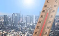 thermometer-in-front-of-cityscape