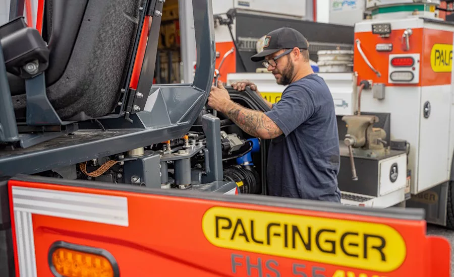 Mechanic-working-on-palfinger-forklift