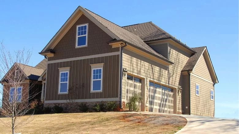 brown and beige wooden house under blue sky