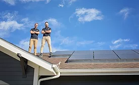 elite-roofing-and-solar-owners-standing-on-a-residential-roof
