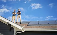 elite-roofing-and-solar-owners-standing-on-a-residential-roof