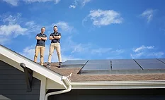 elite-roofing-and-solar-owners-standing-on-a-residential-roof