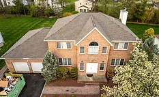 A completed roofing job on a 2 story home