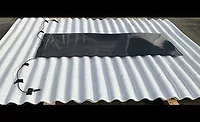 Thin-solar-cell-rolled-onto-mock-roof