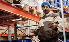 supply-chain-warehouse-prices man-scanning-supplies-in-warehouse