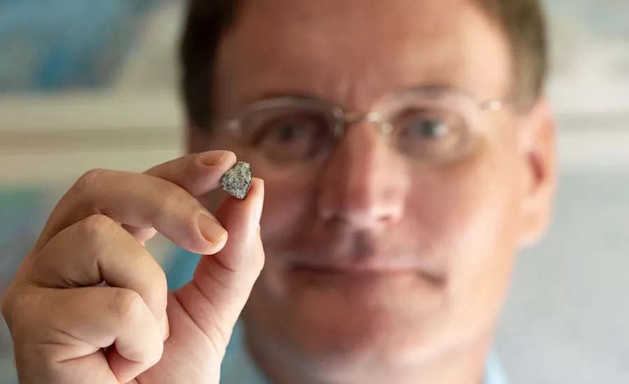 researcher-holding-meterorite