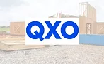 QXO logo overlayed on photo of a residential construction site