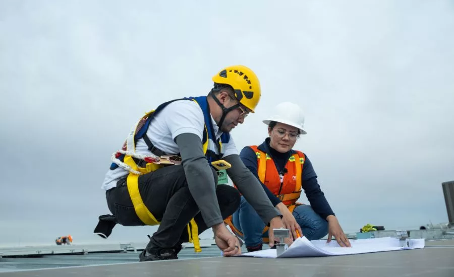 Two construction workers looking at plans