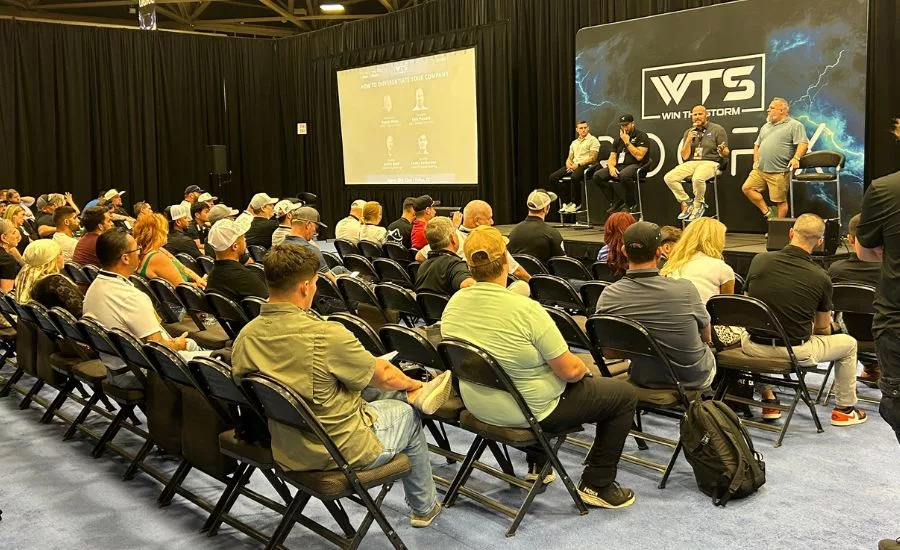 roofers watch an educational session at Win the Storm