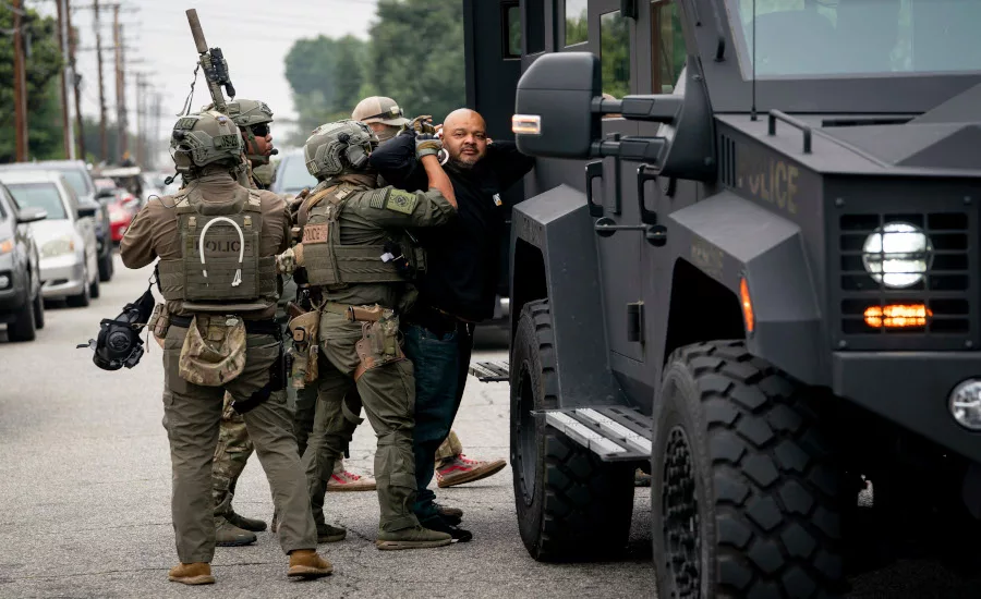 ICE-police-arrest-with-tactical-vehicle