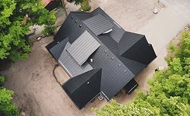 drone image of a black metal roof