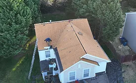 Bumble-Roofing-Charlotte-working-on-home