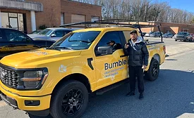 Damiere-Byrd-with-Bumble-Roofing-pickup-truck