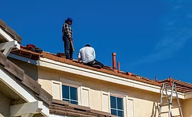 two-workers-on-a-roof