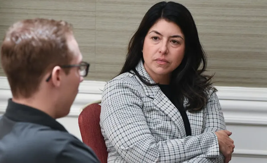 Anissa Westfall, brand strategist with Westfall Roofing and a Young Gun alumna, speaks with Locatelli during the 2024 Young Guns event