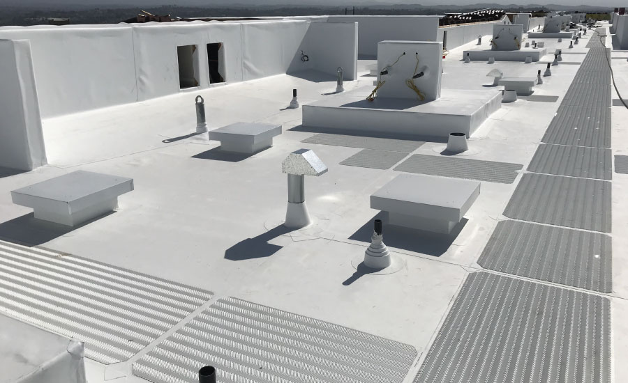 A finished commercial roof, including flashings