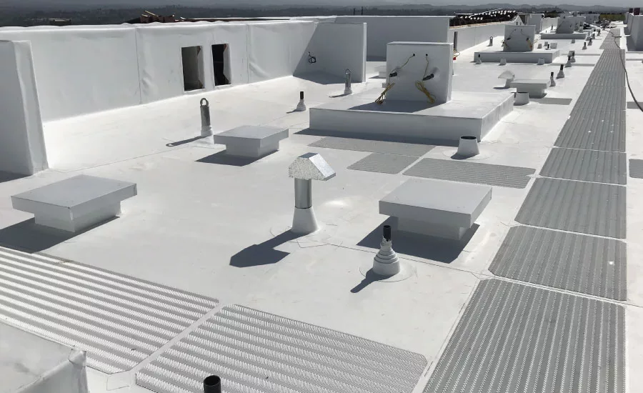 A finished commercial roof, including flashings