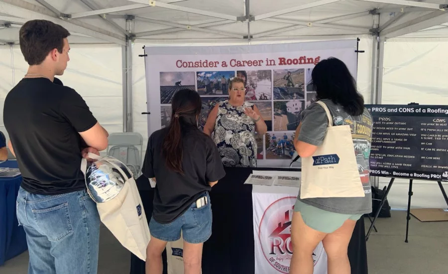 Students-speaking-with-Sharples-under-canopy