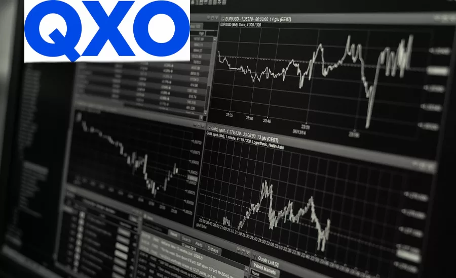 QXO-logo-overlaid-with-finance-reports-on-computer