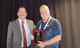 Will-Lorenz-and-Josh-Poole-holding-award