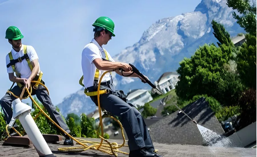 roofing contractors applying shingle treatment