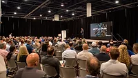 Attendees at METALCON 2025 watching the keynote speaker
