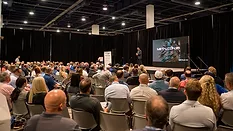 Attendees at METALCON 2025 watching the keynote speaker