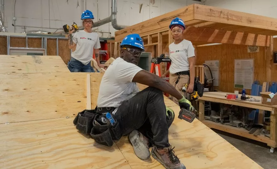 three students learning framing